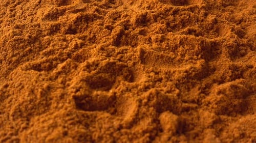 Heap of Fine Orange-Brown Spice Powder Close Up
