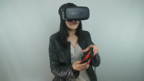 Woman Uses VR Headset with Controller