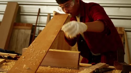 Woodwork and furniture making concept. Stylish craftsman working in his carpentry workshop