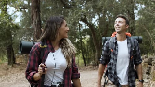 Couple Hiking Together in a Dense Forest