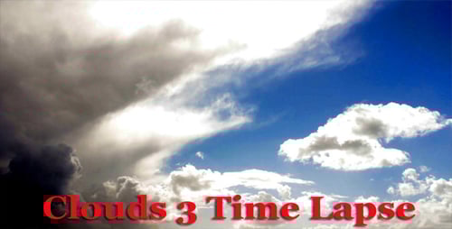 Billowing Clouds Drifting across a Blue Sky