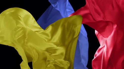 Colorful Fabric Flowing Against Black Background