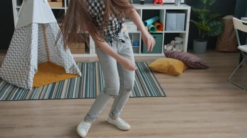 Girl Dancing, Wearing Headphones in her Room