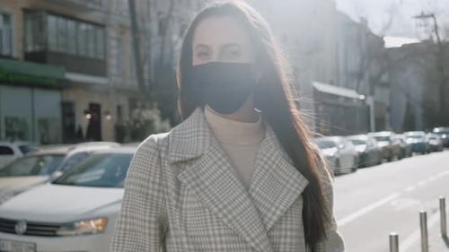Stylish Woman Wearing Face Mask on City Street