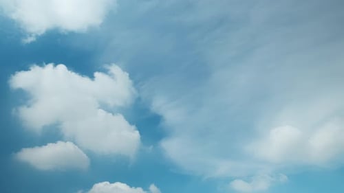 Cloudscape with Blue Sky and White Puffy Clouds