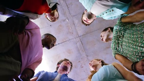 Group Stacks Hands in a Display of Unity