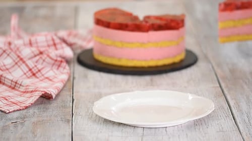 Piece of Fruit Jelly Cake being Placed on Plate