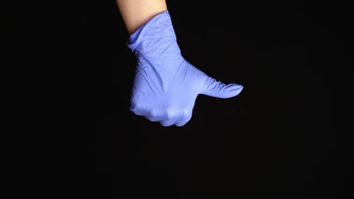 Hand in Blue Glove Points Downwards