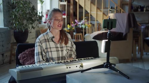 Woman Teaching Online Music Class From Home
