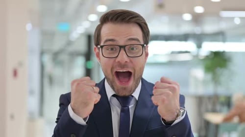 Close Up of Man in Suit Celebrating Success