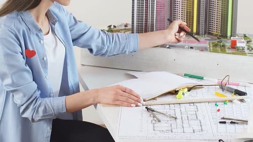 Female Designer Designs the Landscape Around the Buildings of a Large Urban Complex