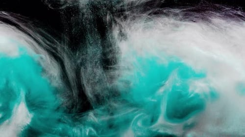 Turquoise Paint Swirling into White Liquid