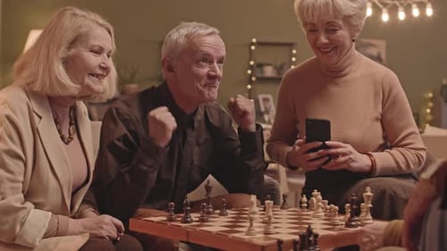 Senior Friends Enjoying a Game of Chess Together
