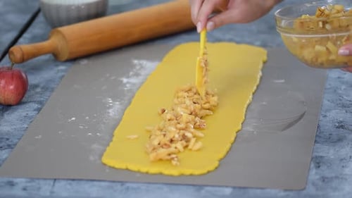 Baking an Apple Pastry in the Kitchen