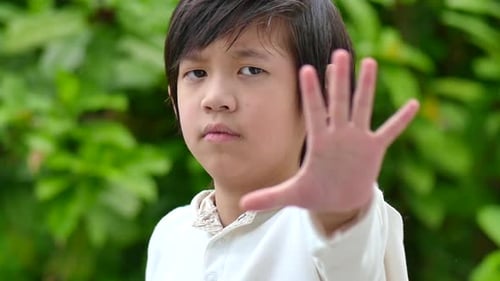Asian Child Show Stop Hands Gesture For Stop
