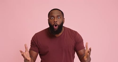 Angry Irritated Young African American Man Isolated on Pink Background