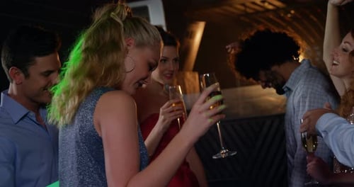 Group of friends dancing in pub