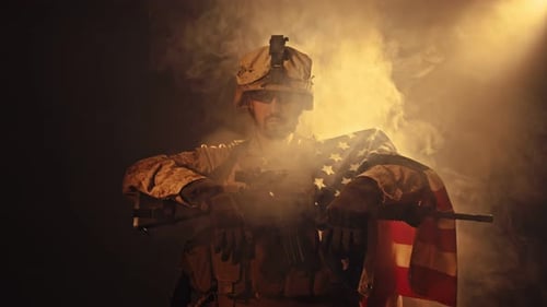 Soldier with American Flag in Smoky Setting
