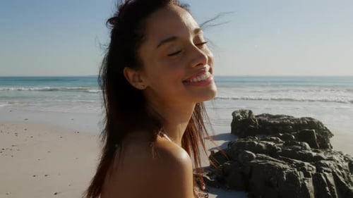 Young woman by the sea