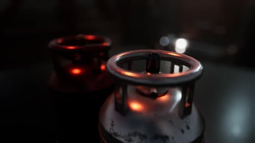 Rotating Metallic Gas Cylinders in a Dark Industrial Scene