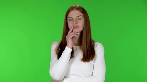 Thoughtful Woman Thinks and Smiles on Green Screen