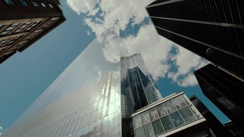 Rotation Bottom View of Skyscrapers with Sky Background