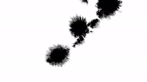 Black Ink Blots Spreading Across White Background