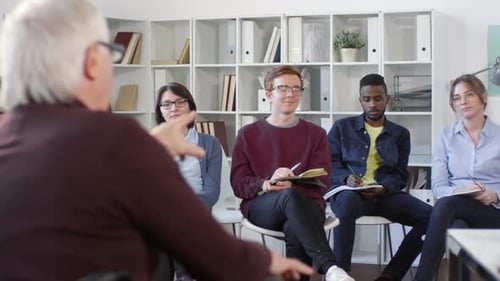 Adults Attending Meeting in Workplace Setting