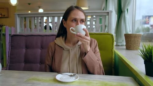Female Drink Coffee in Cafe