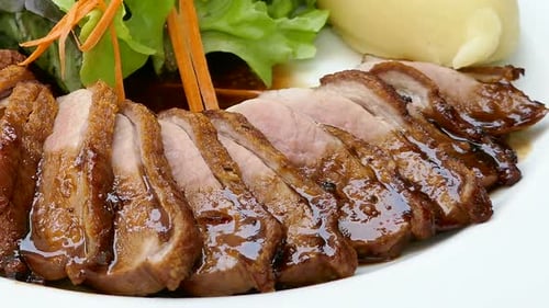 Sliced Duck Breast with Mash and Salad, Close-Up