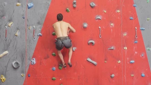 Strong Man Enjoying Rock Climbing