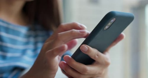 Person Using Cellphone Typing