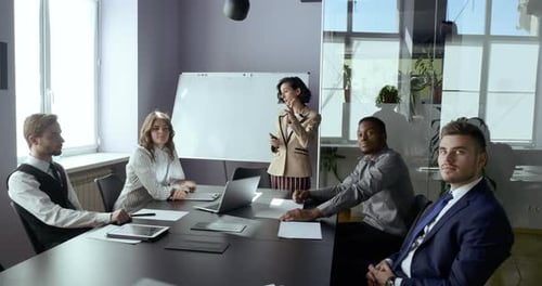 Business Presentation in Conference Room with Team