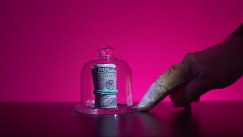 Save Money for Investment Concept. Under a Glass Cover