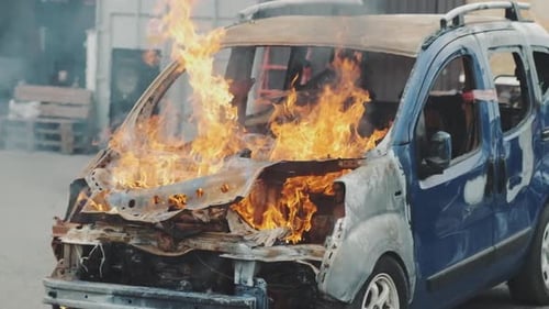 Car Burns After a Road Accident