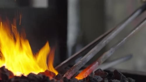Blacksmith Working at a Hot Fire Forge