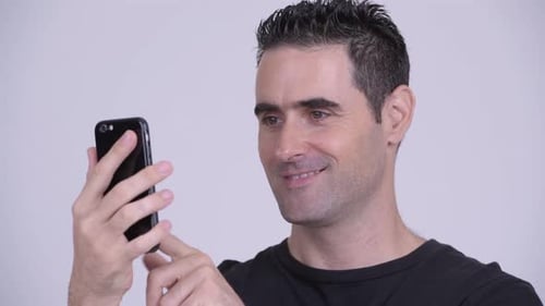 Man Using Smartphone and Smiling Close Up
