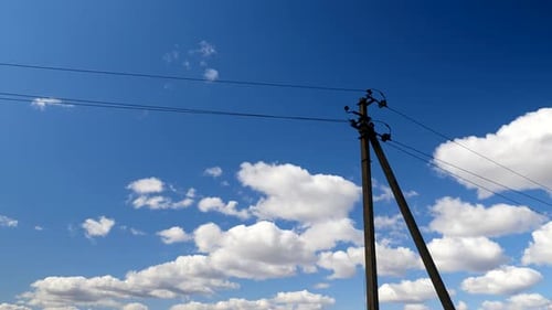Electric Line Pylons Against a Blue Sky