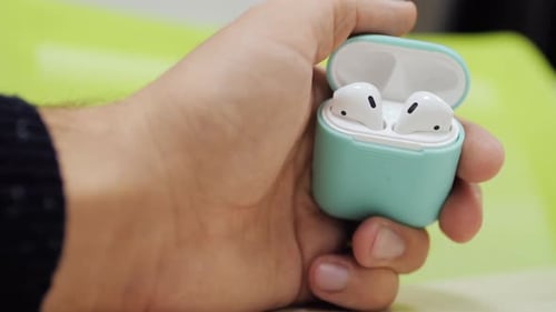 Closeup Hands of Unrecognizable Man Open Case Wireless Headphones