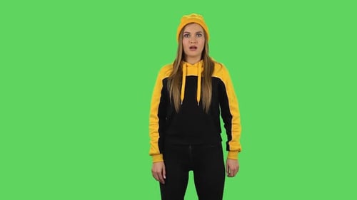 Modern Upset Girl in Yellow Hat with Shocked Wow Face Expression. Green Screen