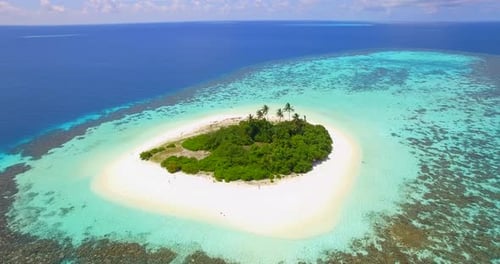 Aerial drone view of a scenic tropical island in the Maldives.