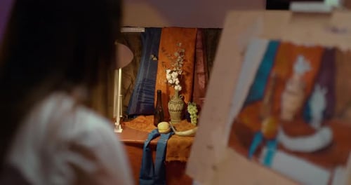 Creative Workshop of the Artist a Young Woman Draws with Paints on an Easel