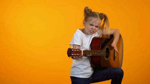 Funny Preteen Girl Pretending to Play Guitar Dreaming to Become Famous Rock Star