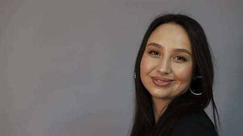 Attractive Woman Smiling Gently at the Camera