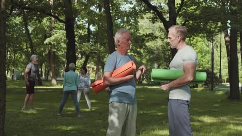 Adults Practicing Yoga Class in Green Park