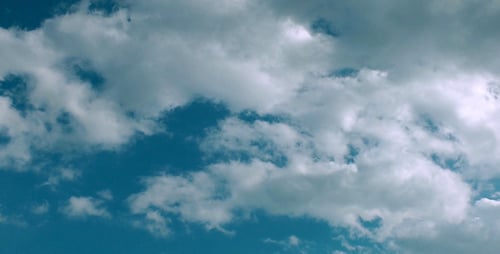 Clouds Moving Quickly in a Bright Blue Sky