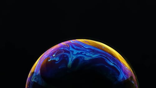 Multicolored Rainbow Colors of a Single Soap Bubble That Looks Like a Fantasy Planet Isolated