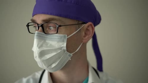 Medical Professional Wearing Mask and Surgical Cap