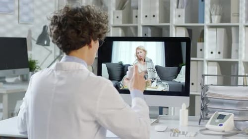 Doctor Consults Patient Remotely During Telemedicine Appointment