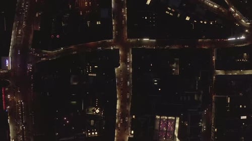 AERIAL: Slow Overhead Shot of City at Night with Lights and Traffic, Cologne, Germany
